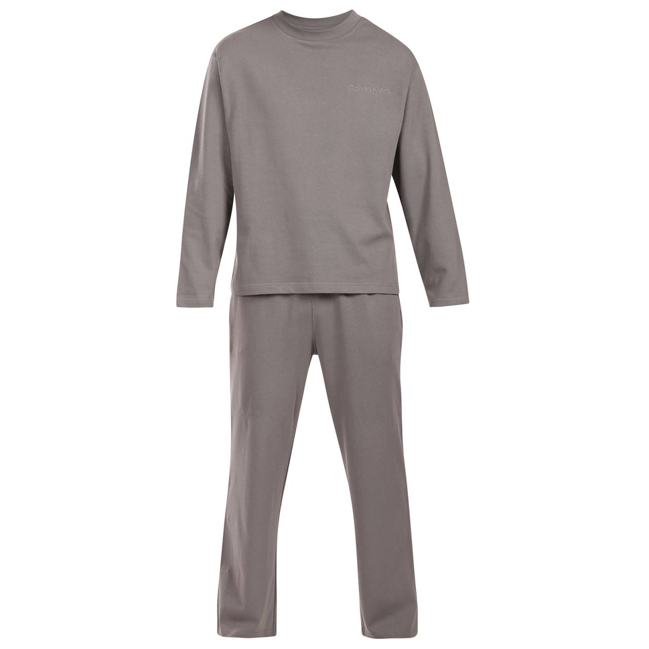 Pánske pyžamo Calvin Klein šedé (NM2951-PR8) L.
Vychutnajte si svoje večery a rána v štýle Calvin Klein – v pohodlných, mäkkých a elegantných pánskych pyžamách, ktoré vás doslova pohladia.
Čistá bavlna pre prirodzený komfort
Pánske pyžamy Calvin Klein sú vyrobené zo 100 % bavlny, ktorá je priedušná, mäkká a príjemná na dotyk.
Elegantný vzhľad, ktorý si zamilujete
Jednofarebné tričko s dlhým rukávom a dlhé vzorované nohavice sú klasickou kombináciou, ktorá vyzerá štýlovo a sofistikovane.
Prečo by ste mali vyskúšať pyžamo Calvin Klein

100 % bavlna: Prírodný, priedušný a pohodlný materiál, ktorý zaručuje komfort.
Nadčasový a elegantný dizajn Calvin Klein: Jednoduchosť, ktorá vyzerá skvele.
Pohodlný strih pre voľnosť pohybu: Ideálne na spanie a relaxáciu doma.

Spodná bielizeň Calvin Klein je obľúbená u ľudí po celom svete
Spodná bielizeň Calvin Klein je základným prvkom módneho priemyslu.
Ako sa starať o pyžamy Calvin Klein

Pranie: Práťte na 30 °C, ideálne naruby a s podobnými farbami.
Sušenie: Pyžamo môžete bezpečne sušiť v sušičke pri nízkej teplote.
Žehlenie: Žehlenie nie je potrebné – materiál je dostatočne hladký, ale ak máte radi dokonalý vzhľad, žehlite pri nízkej teplote a naruby, bez naparovania.

Tip: Staňte sa odborníkom na starostlivosť o spodnú bielizeň vďaka tipom v našom článku a poskytnite svojim obľúbeným kúskom starostlivosť, ktorú si zaslúžia.