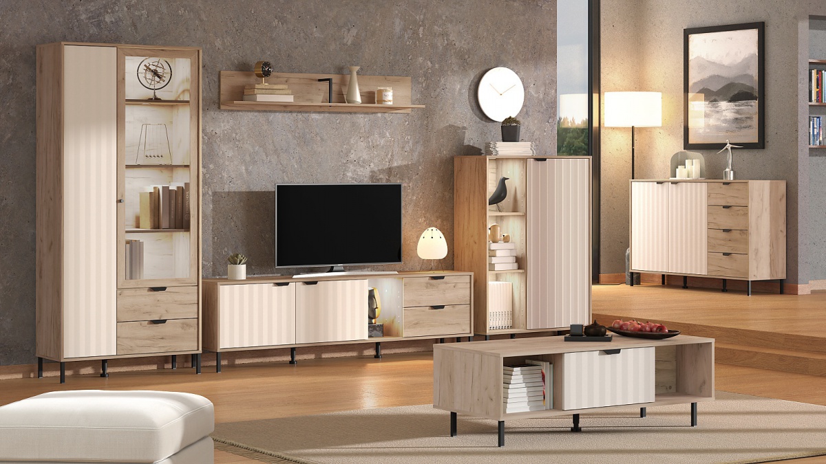 Obývacia izba s osvetlením xaden - dub šedý/béžová.

 

Kombinovaná komoda je ideálnou voľbou pre všetkých, ktorí zháňajú praktický kus nábytku, ktorý nielen skvele poslúži, ale navyše bude vyzerať štýlovo.

 

Konferenčný stolík je vybavený výklopnými dvierkami, ktoré je možné otvoriť z oboch strán.

 

Vysoká vitrína je opatrená dvierkami, ktoré sú ozvláštnené pruhovaným vzorom, čo vytvára unikátny dizajn.

 

TV stolík je absolútnou nevyhnutnosťou každej obývacej izby.

 

Nástenná polica je tým kusom nábytku, ktorý sa hodí naozaj všade.

 

Minimalistická vitrína, ktorá nielen skvele vyzerá, ale navyše aj perfektne poslúži.

 

Obývacia izba s osvetlením sa skladá z týchto prvkov:


	Široká komoda Xaden - 157x92,5x40cm (š, v, h)
	Konferenčný stolík Xaden - 120,5x41,5x54,5cm (š, v, h)
	Vysoká vitrína s vnútorným osvetlením Xaden - 86x195x40cm (š, v, h)
	TV stolík s osvetlením Xaden - 182,5x54x40cm (š, v, h)
	Nástenná polica Xaden - 137,5x24x19,5cm (š, v, h)
	Vitrína I s vnútorným osvetlením Xaden - 86x131x40cm (š, v, h)


 

Všetky produkty z kolekcie Xaden nájdete nižšie v súvisiacich produktoch.